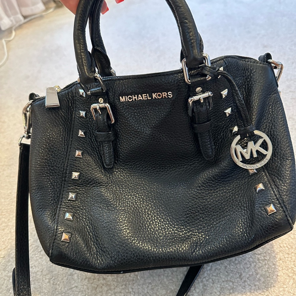 Black and silver studded michael kors bag